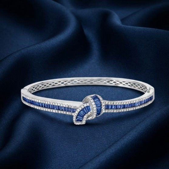 Zaviera Eternal Knot Bangle - white sterling silver bracelet with pave knot detail